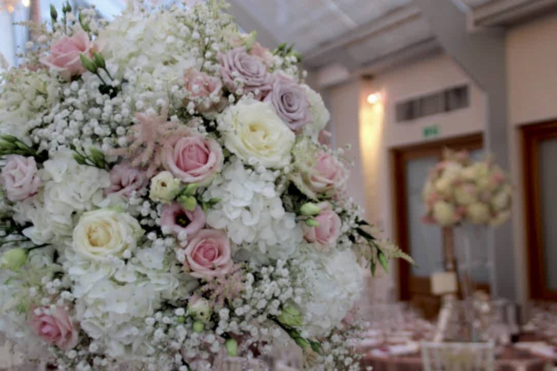 glam white and blush wedding flowers with rose gold touches