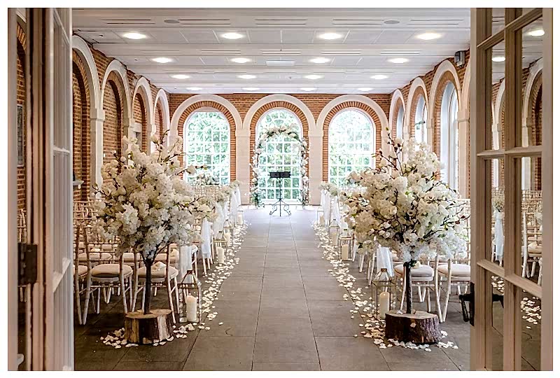 rustic wedding flowers, great Fosters wedding ceremony aisle, with rustic flower trees and rose petals scatter and gold lanterns