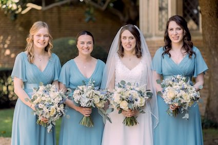 sky blue wedding flowers at Great Fosters in surrey, bridesmaids bouquets with sky blue dresses