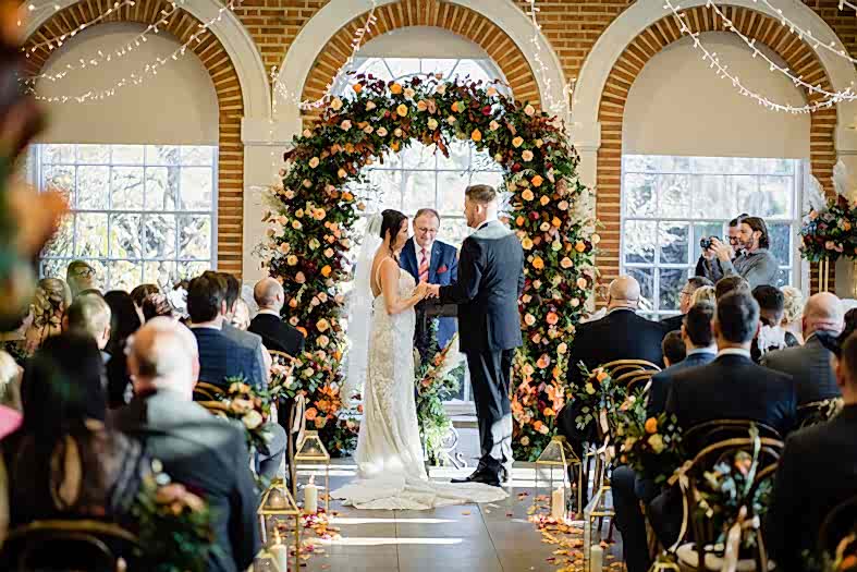 luxury autumn wedding flowers arch by recommended florist at great Fosters in egham