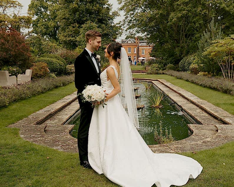 white luxury wedding flowers arch at the royal berkshire hotel, royal berkshire luxury wedding flowers