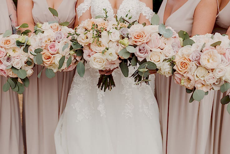 champagne blush wedding flowers bouquets of roses and spray roses at Great Fosters